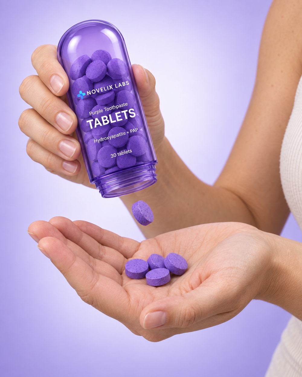 Purple tablets poured from the tube into an open palm
